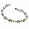 Thumbnail Image 1 of Oval Peridot and Diamond Accent Bracelet in Sterling Silver - 7.25"
