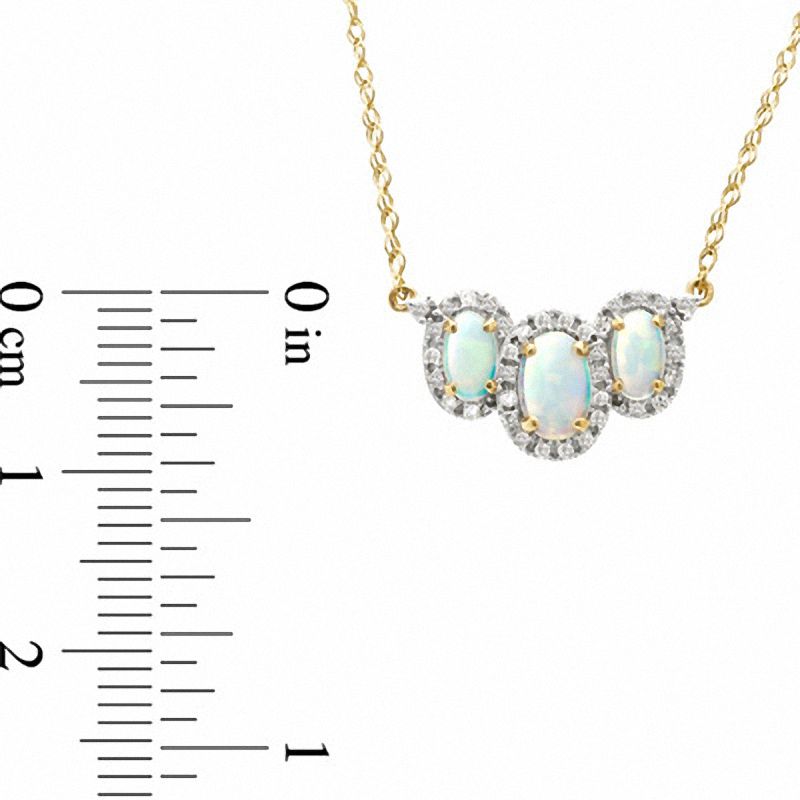 Main Image 2 of Oval Lab-Created Opal and 1/10 CT. T.W. Diamond Necklace in 14K Gold