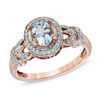 Thumbnail Image 1 of Oval Aquamarine and 1/6 CT. T.W. Diamond Frame Vine Ring in 10K Rose Gold