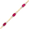 Thumbnail Image 1 of Oval Lab-Created Ruby and Diamond Accent Bracelet in Sterling Silver and 10K Gold Plate - 7.25&quot;