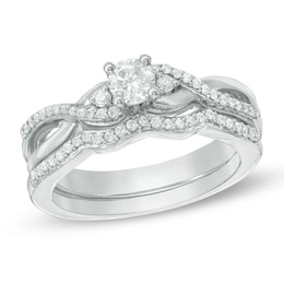 1/3 CT. T.W. Diamond Three Stone Twist Bridal Set in Sterling Silver