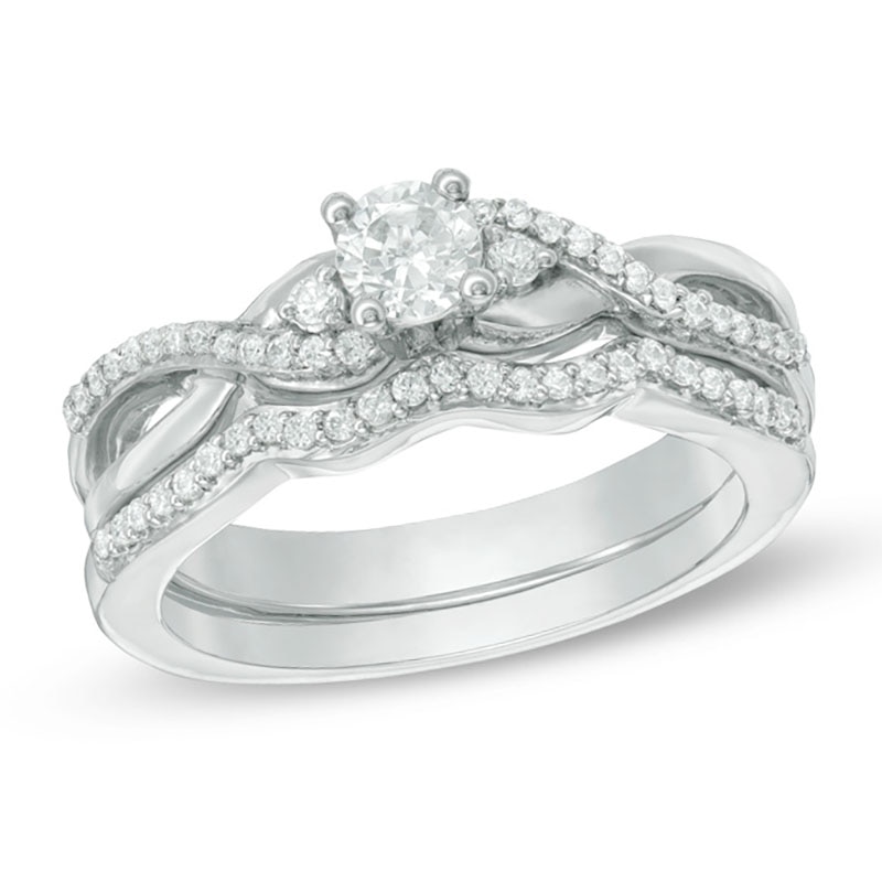 Main Image 1 of 1/3 CT. T.W. Diamond Three Stone Twist Bridal Set in Sterling Silver