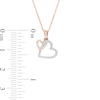 Thumbnail Image 3 of 1/20 CT. T.W. Diamond Interlocking Double Tilted Heart Pendant in 10K Rose Gold