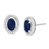 Thumbnail Image 0 of Oval Blue Sapphire and 1/8 CT. T.W. Diamond Frame Stud Earrings in 10K White Gold