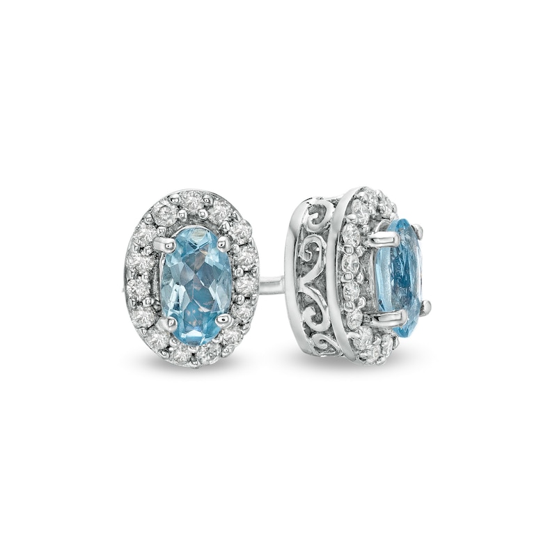 Main Image 1 of Oval Aquamarine and 1/6 CT. T.W. Diamond Frame Stud Earrings in 10K White Gold