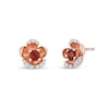 Thumbnail Image 1 of Enchanted Disney Snow White 3.0mm Garnet and 1/10 CT. T.W. Diamond Flower Stud Earrings in 10K Rose Gold