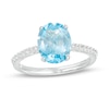 Thumbnail Image 1 of Oval Swiss Blue Topaz and White Lab-Created Sapphire Tapered Shank Ring in Sterling Silver