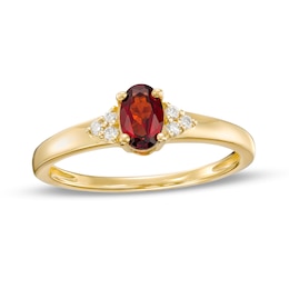 Oval Garnet and 1/20 CT. T.W. Diamond Tri-Sides Ring in 10K Gold - Size 7