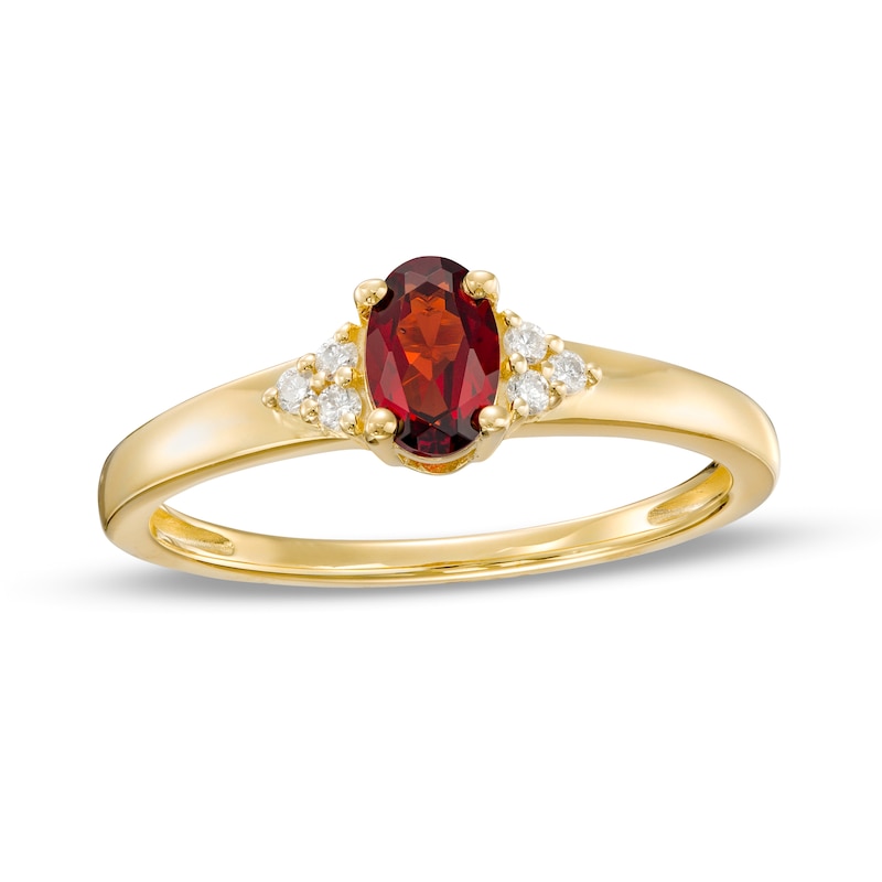 Main Image 1 of Oval Garnet and 1/20 CT. T.W. Diamond Tri-Sides Ring in 10K Gold - Size 7