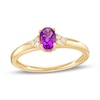 Thumbnail Image 1 of Oval Amethyst and 1/20 CT. T.W. Diamond Tri-Sides Ring in 10K Gold - Size 7