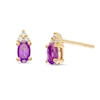 Thumbnail Image 1 of Oval Amethyst and 1/20 CT. T.W Diamond Stud Earrings in 10K Gold