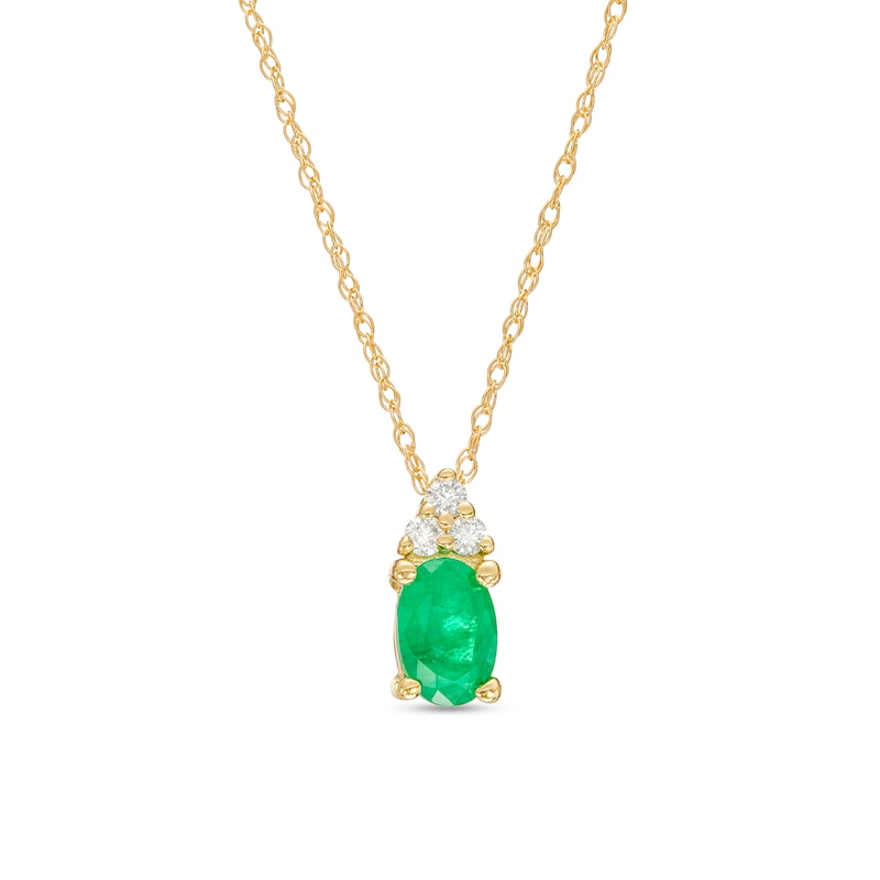 Main Image 1 of Oval Emerald and 1/20 CT. T.W. Diamond Tri-Sides Pendant in 10K Gold