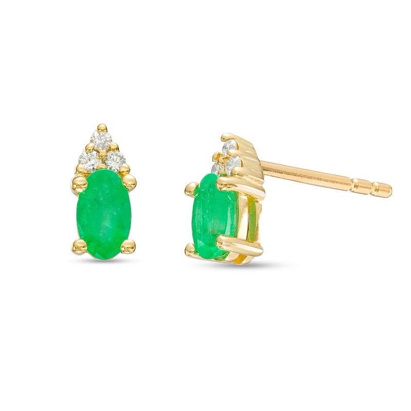 Main Image 1 of Oval Emerald and 1/20 CT. T.W. Diamond Stud Earrings in 10K Gold