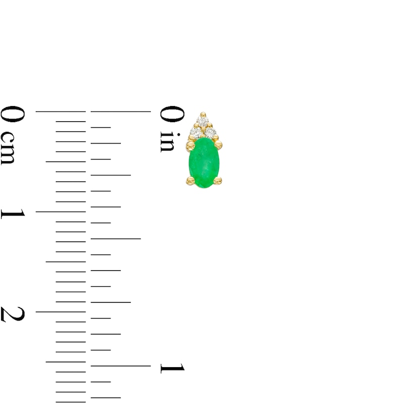 Main Image 3 of Oval Emerald and 1/20 CT. T.W. Diamond Stud Earrings in 10K Gold