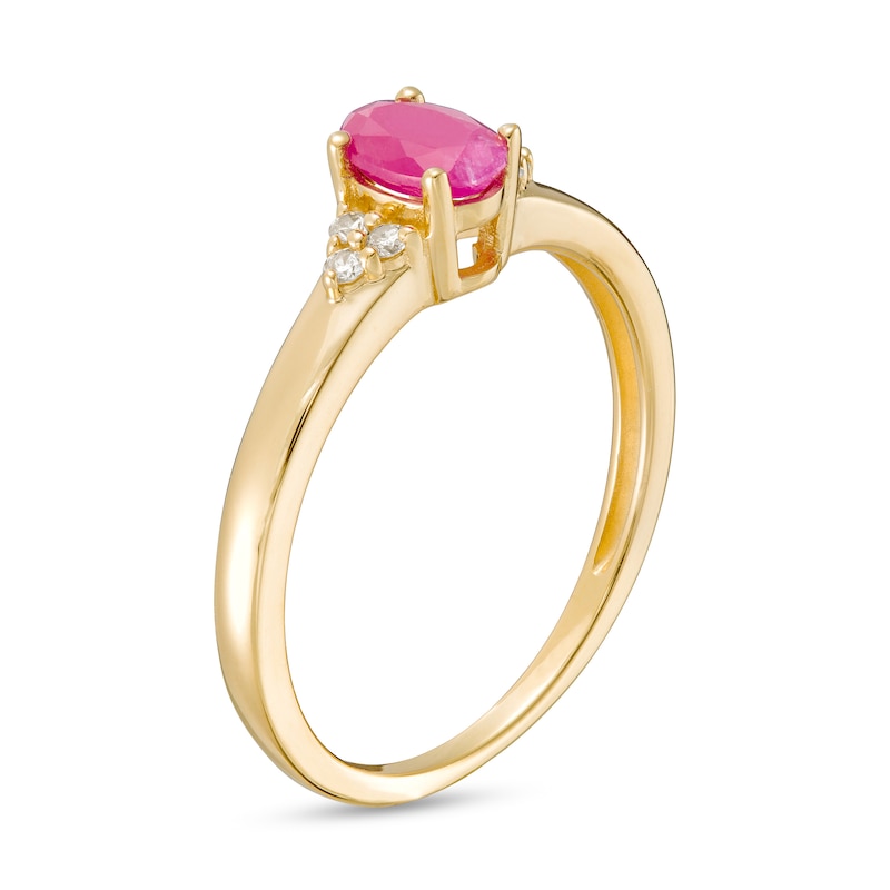 Main Image 3 of Oval Ruby and 1/20 CT. T.W. Diamond Tri-Sides Ring in 10k Gold - Size 7