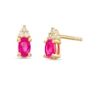 Thumbnail Image 0 of Oval Ruby and 1/20 CT. T.W. Diamond Stud Earrings in 10K Gold