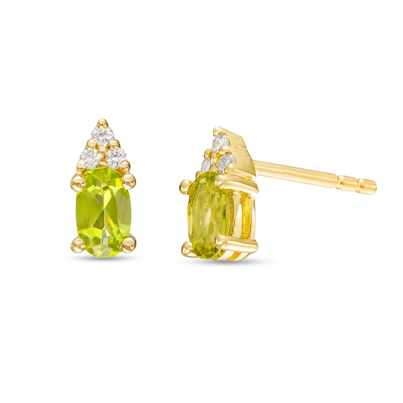 Main Image 1 of Oval Peridot and 1/20 CT. T.W. Diamond Stud Earrings in 10K Gold