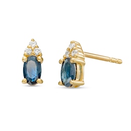 Oval Blue Sapphire and 1/20 CT. T.W. Diamond Stud Earrings in 10K Gold