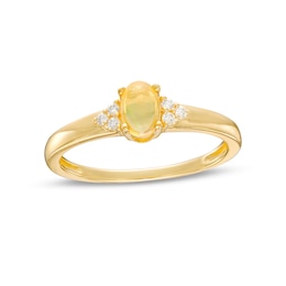 Oval Opal and 1/20 CT. T.W. Diamond Tri-Sides Ring in 10K Gold - Size 7