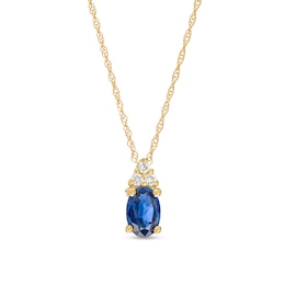 Oval Blue Sapphire and 1/20 CT. T.W. Diamond Pendant in 10K Gold