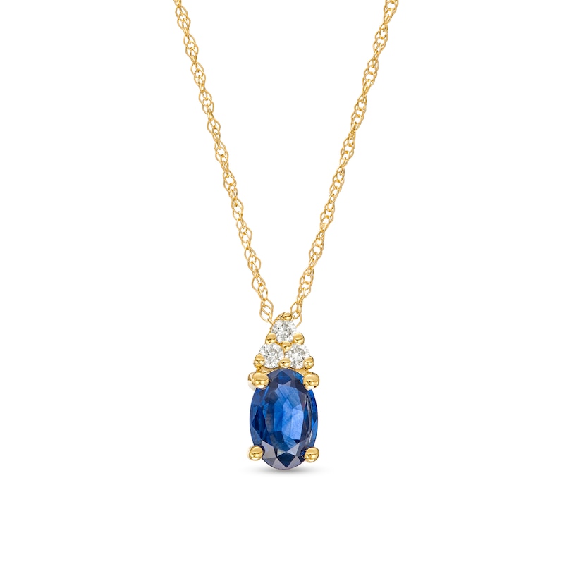 Main Image 1 of Oval Blue Sapphire and 1/20 CT. T.W. Diamond Pendant in 10K Gold