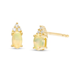 Oval Opal and 1/20 CT. T.W. Diamond Stud Earrings in 10K Gold