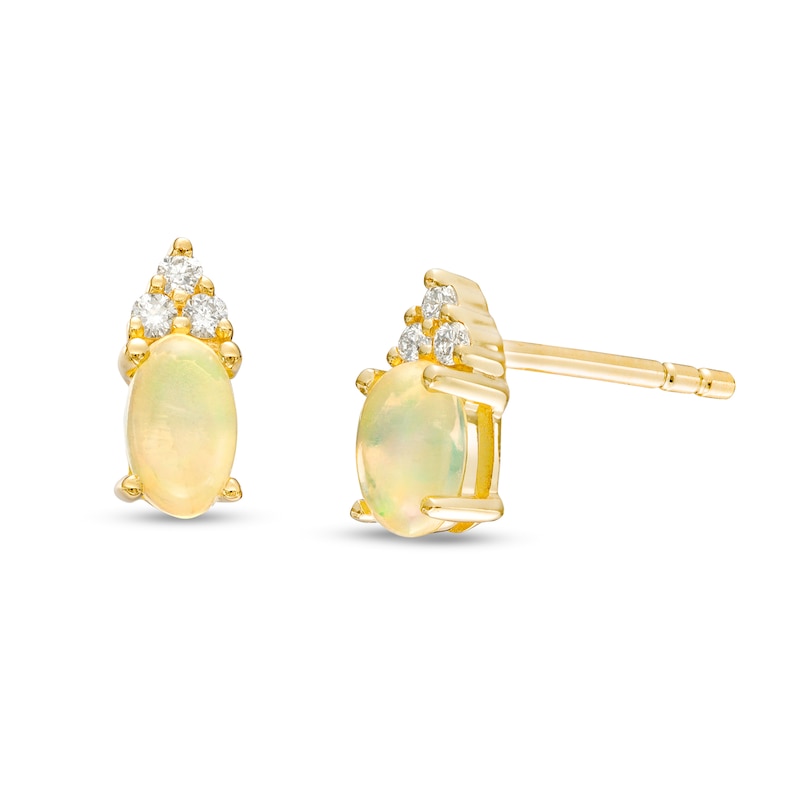 Main Image 1 of Oval Opal and 1/20 CT. T.W. Diamond Stud Earrings in 10K Gold