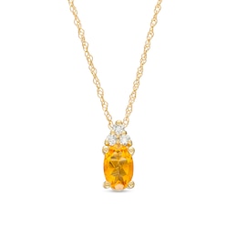 Oval Citrine and 1/20 CT. T.W. Diamond Pendant in 10K Gold