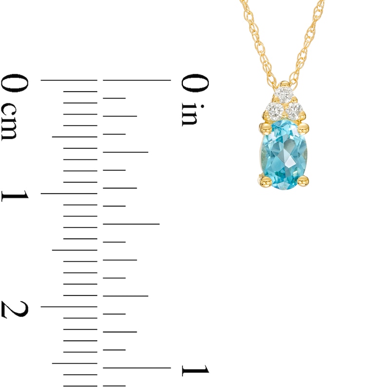 Oval Swiss Blue Topaz and 1/20 CT. T.W. Diamond Pendant in 10K Gold