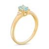 Thumbnail Image 3 of Oval Swiss Blue Topaz and 1/20 CT. T.W. Diamond Tri-Sides Ring in 10K Gold - Size 7