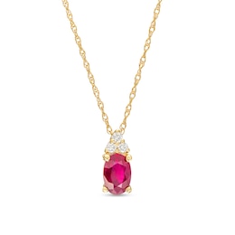 Oval Ruby and 1/20 CT. T.W. Diamond Pendant in 10K Gold