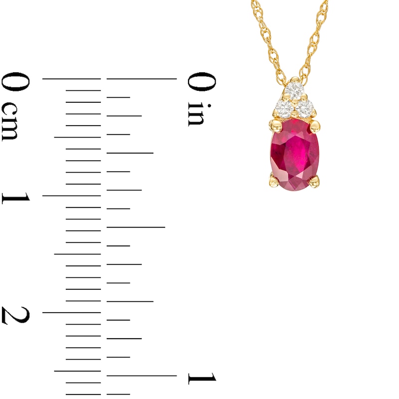 Main Image 3 of Oval Ruby and 1/20 CT. T.W. Diamond Pendant in 10K Gold