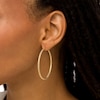 Thumbnail Image 2 of Oro Diamante™ 45.0mm Diamond-Cut Glitter Tube Hoop Earrings in 14K Gold