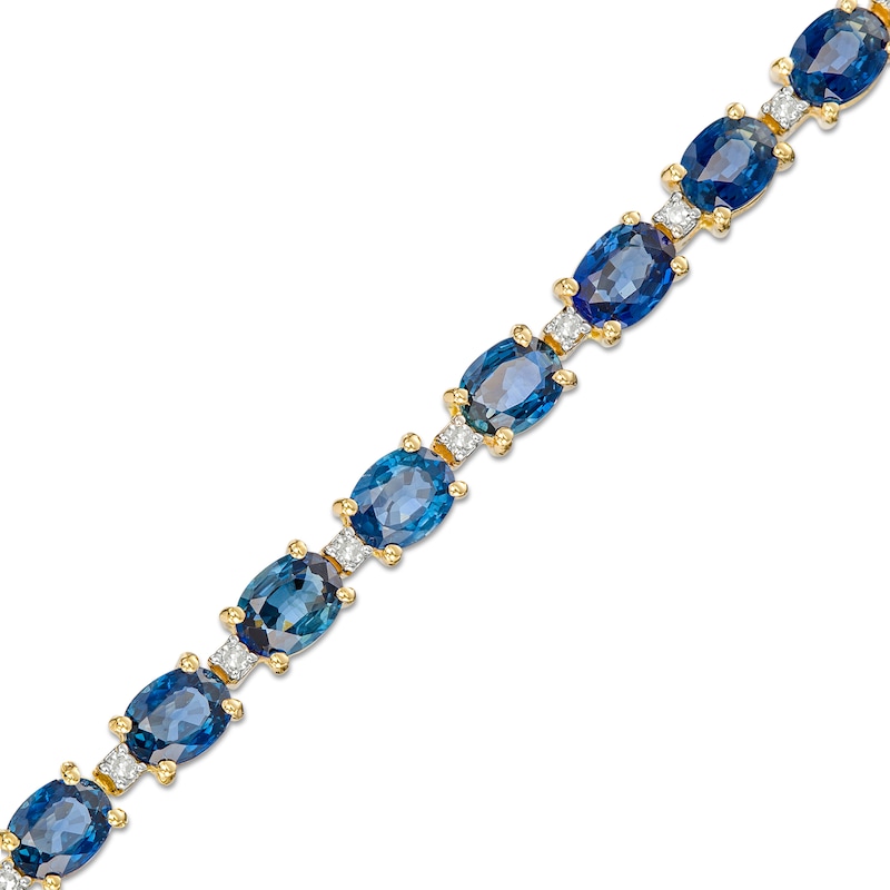 Main Image 1 of Oval Blue Sapphire and 1/6 CT. T.W. Diamond Alternating Line Bracelet in 10K Gold