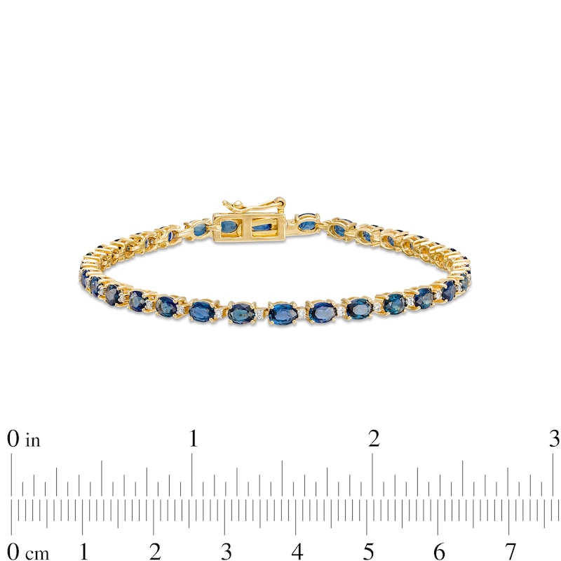 Main Image 4 of Oval Blue Sapphire and 1/6 CT. T.W. Diamond Alternating Line Bracelet in 10K Gold