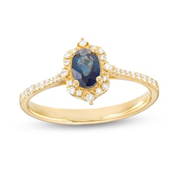 Oval Blue Sapphire and 1/6 CT. T.W. Diamond Ornate Frame Tapered Shank Ring in 10K Gold