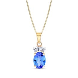 Oval Tanzanite and 1/15 CT. T.W. Baguette Diamond Pendant in 14K Gold