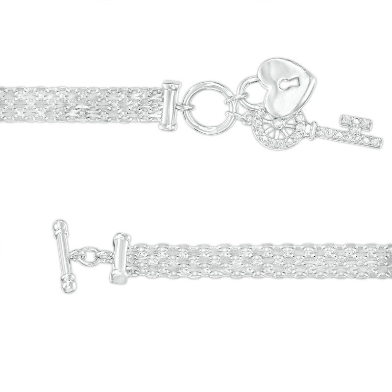 1/10 CT. T.W. Diamond Heart Lock and Key Dangle Charm Bracelet in Sterling Silver - 7.25"