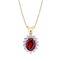 Oval Garnet and 1/5 CT. T.W. Diamond Sunburst Frame Split Bale Pendant in 14K Gold