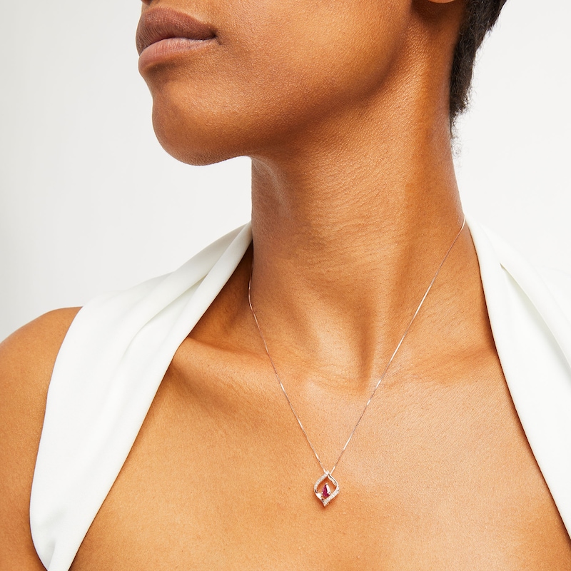 Main Image 2 of Pear-Shaped Ruby and 1/15 CT. T.W. Diamond Twist Frame Pendant in 10K Rose Gold