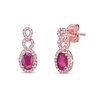 Thumbnail Image 1 of Oval Ruby and 1/4 CT. T.W. Diamond Loop Frame Doorknocker Drop Earrings in 10K Rose Gold