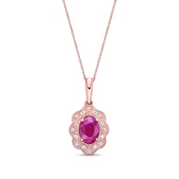 Oval Ruby and 1/15 CT. T.W. Diamond Scallop Frame Vintage-Style Flower Drop Pendant in 10K Rose Gold