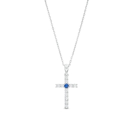 Blue Sapphire and 1/4 CT. T.W. Diamond Cross Pendant in Sterling Silver