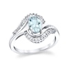 Thumbnail Image 1 of Oval Aquamarine and 1/3 CT. T.W. Baguette Diamond Frame Bypass Ring in 14K White Gold