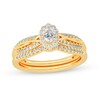 Thumbnail Image 1 of 1/2 CT. T.W. Oval Diamond Frame Overlay Bridal Set in 14K Gold
