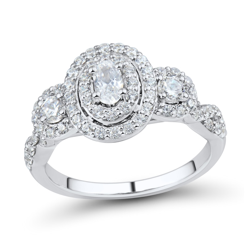 Main Image 1 of 1 CT. T.W. Oval Diamond Frame Three Stone Twist Shank Engagement Ring in 14K White Gold (I/I1)