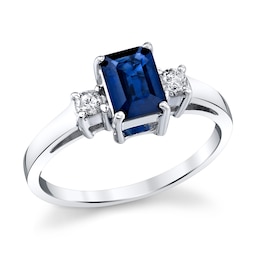 Emerald-Cut Blue Sapphire and 1/6 CT. T.W. Diamond Three Stone Ring in 14K White Gold