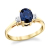 Thumbnail Image 1 of Oval Blue Sapphire and 1/6 CT. T.W. Diamond Three Stone Ring in 14K Gold