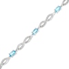 Thumbnail Image 0 of Oval Swiss Blue Topaz and Diamond Accent Infinity Braid Line Bracelet in Sterling Silver - 7.25"