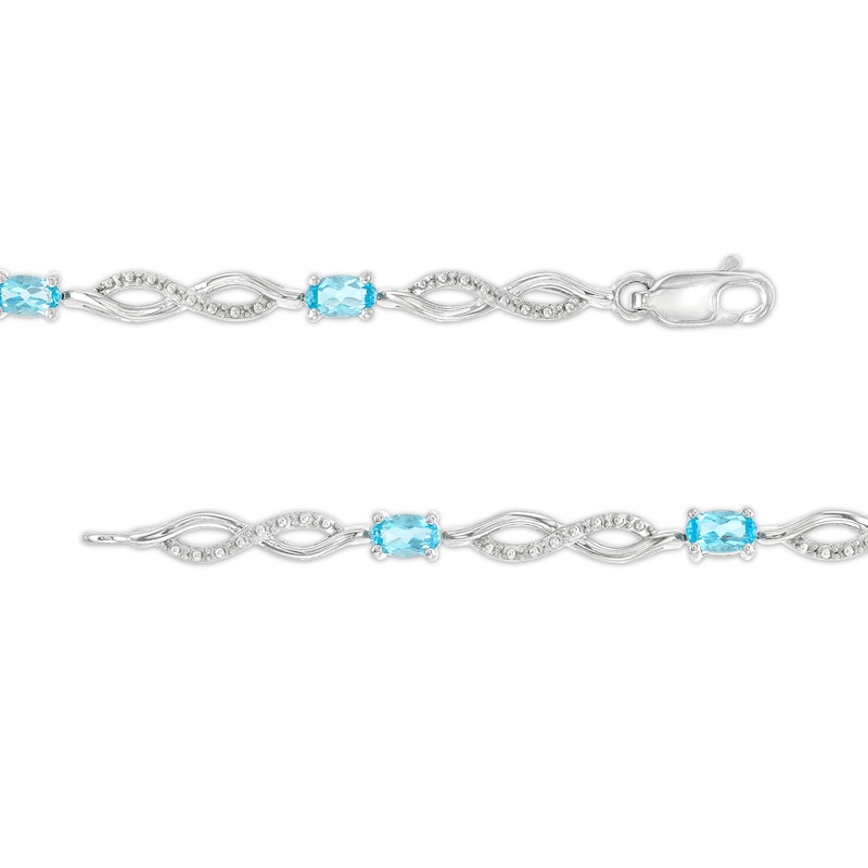 Oval Swiss Blue Topaz and Diamond Accent Infinity Braid Line Bracelet in Sterling Silver - 7.25"